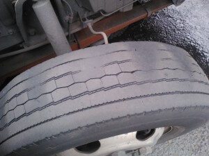 cupped tire, worn shock, worn strut, underinflated tire
