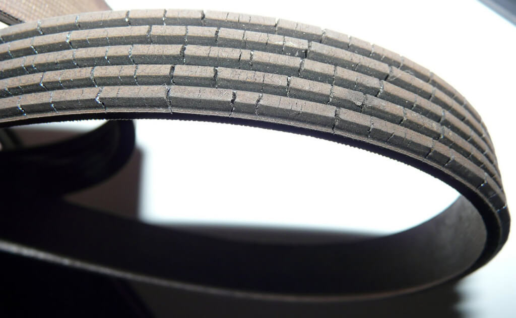 this image shows a cracked serpentine belt