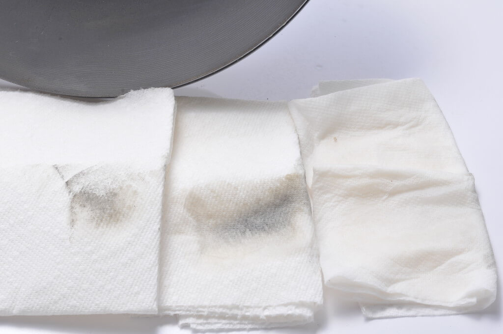 This image shows dirt from brake rotor after washing with soap and water