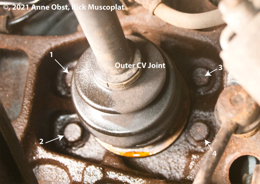 location of subaru wheel bearing bolts