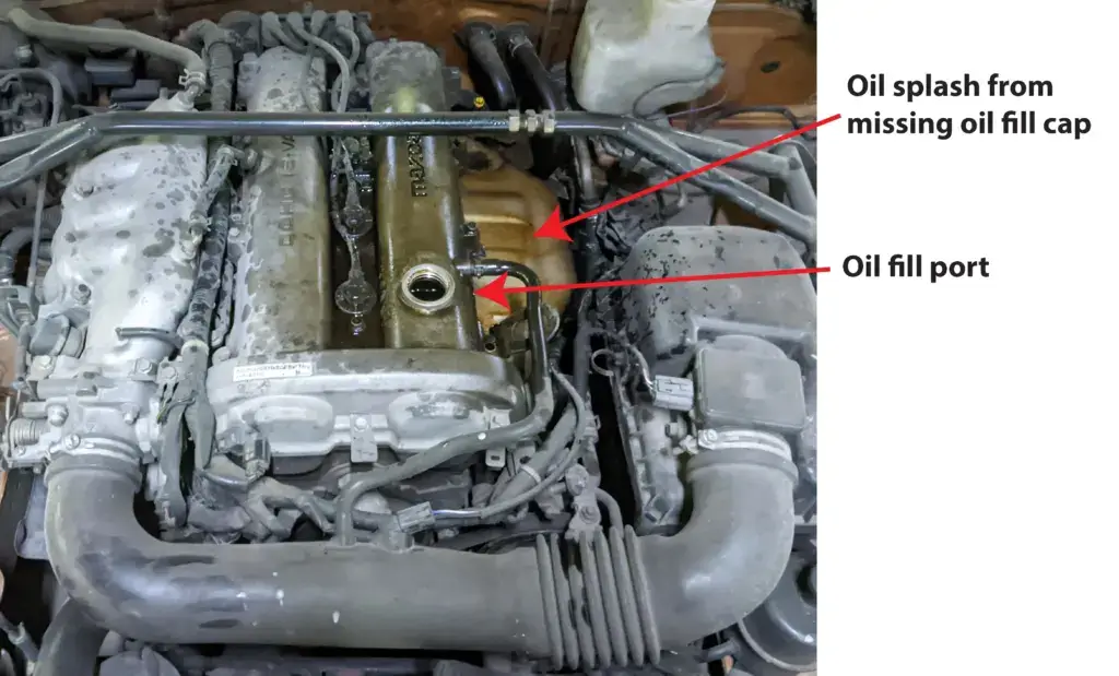 image of engine with missing oil filler cap