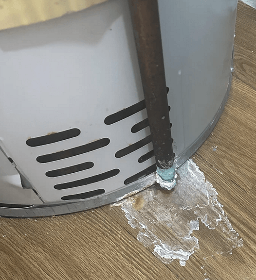 This image shows water discharge from the T&P valve on a water heater