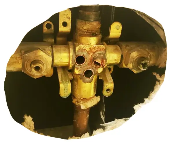 This image shows a damaged Delta Monitor shower valve