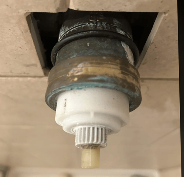 This image shows a stuck Delta Bonnet nut